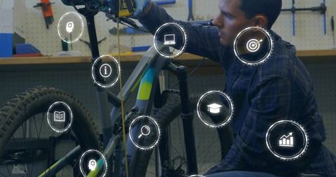 Mechanic tuning mountain bike with cordless drill and measuring tape with HUD tech overlay