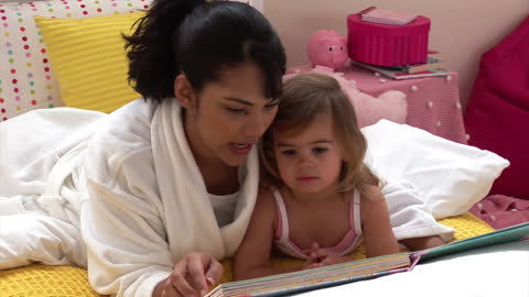 Mother and Child Reading Together in Cozy Bedroom
