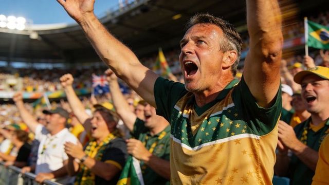 Passionate fan cheering and raising arms in vibrant stadium crowd with flags and energy