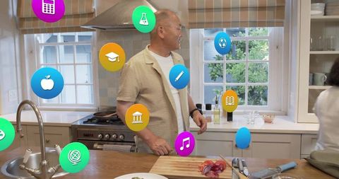 Man standing in bright family kitchen with colorful floating app icons above island