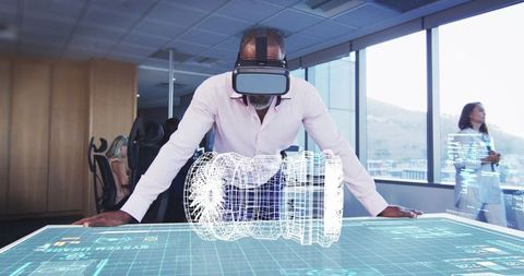 Businessman engaging with holographic display using vr in modern office