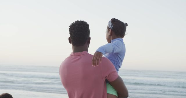 Father Holding Daughter Looking at Ocean - Download Free Stock Images Pikwizard.com