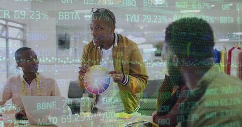 Creative Team Analyzing Financial Trends in Modern Office Environment