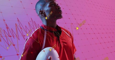 Male athlete holding football with neon analytics overlay and futuristic data grid