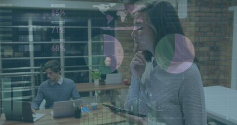 Business Colleagues Analyzing Digital Financial Data in Modern Office