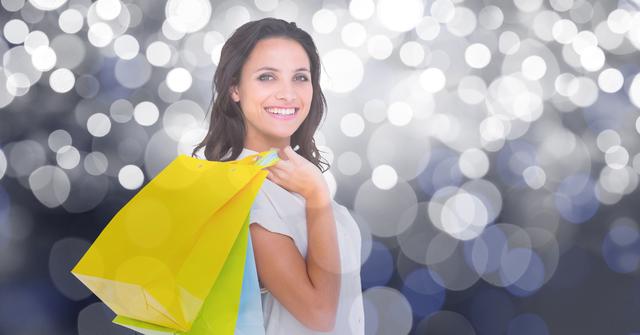 Digital composite of Happy woman carrying shopping bags over bokeh