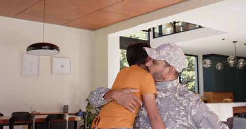 Military Father Embracing Son in Modern Home