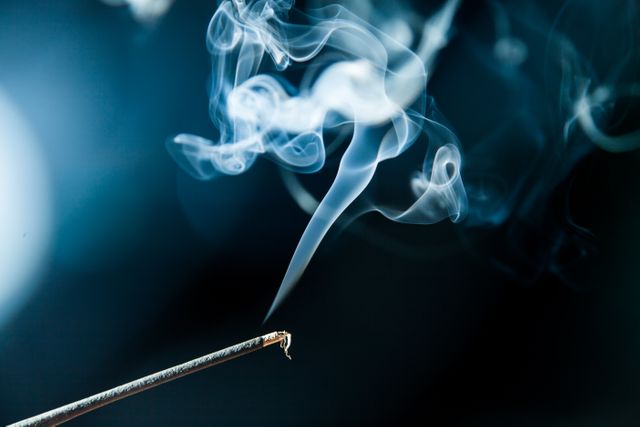 Close-up of Burning Incense Stick with Rising Smoke - Download Free Stock Photos Pikwizard.com