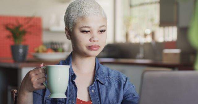 Focused Woman with Coffee Mug Using Laptop at Home - Download Free Stock Images Pikwizard.com