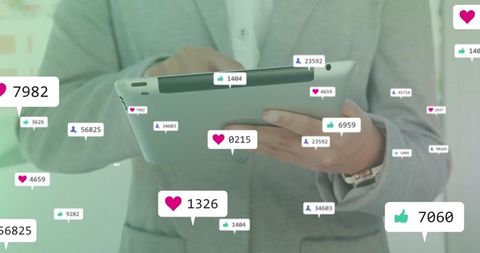 Businessman Using Tablet with Floating Social Media Icons