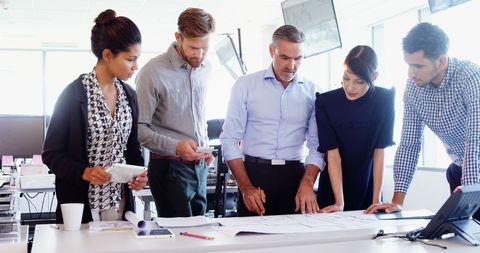 Diverse Business Team Collaborating on Project in Bright Office - Download Free Stock Images Pikwizard.com