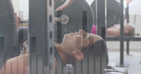 Data overlay on woman weightlifting at gym