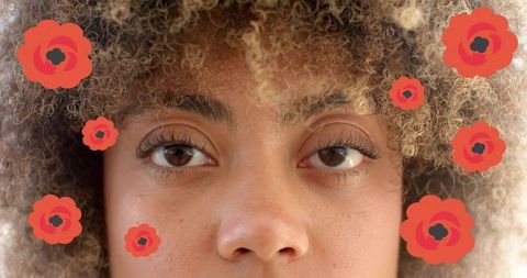 Gazing closeup with curly hair, brown eyes and red poppy overlays