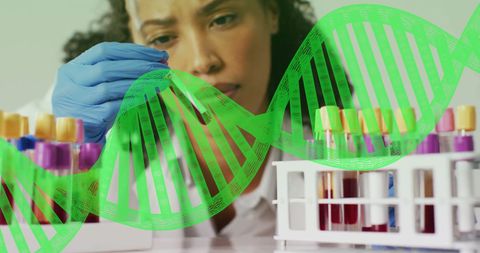 Scientist Analyzing Test Tubes with DNA Overlay in Laboratory