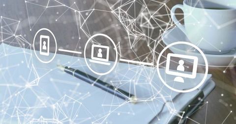 Notebook with pen and coffee cup under digital network overlay for remote collaboration