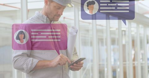 Construction manager checking updates on smartphone