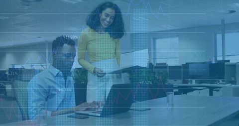 Colleagues Analyzing Report and Charts in Modern Office