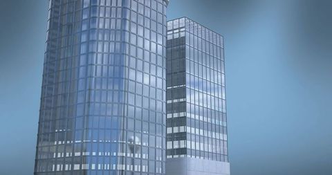 Curved and rectangular glass towers reflecting blue sky with podium and vertical mullions