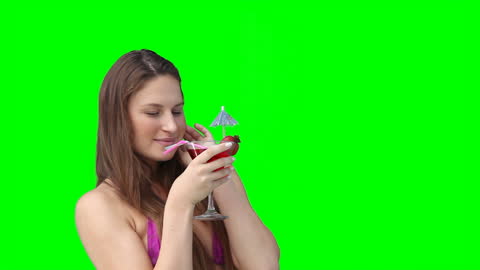 Woman Enjoying Refreshing Drink Against Green Screen