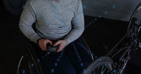 Manual wheelchair user using smartphone with ar data overlay beside handcycle for mobility