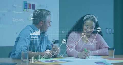 Colleagues Collaborating in Office with Data Overlays