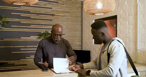 Men collaborating reception desk professional workspace