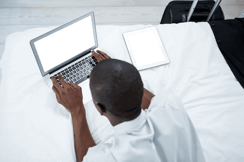 transparent screen devices featuring laptop and tablet on bed - Download Free Stock Videos Pikwizard.com