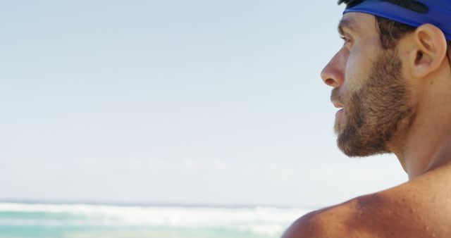 Man Wearing Swim Goggles Looking at Ocean - Download Free Stock Images Pikwizard.com