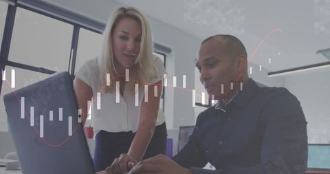 Business Professionals Analyzing Financial Charts in Office Environment