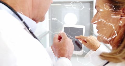 Doctors Collaborating on Digital Tablet with Chemical Structures Overlay