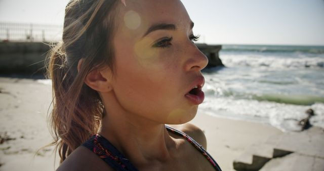 Close-up of Physically Active Woman Taking a Break at the Beach - Download Free Stock Images Pikwizard.com