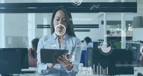 Businesswoman Using Tablet with Financial Data Animation Overlay