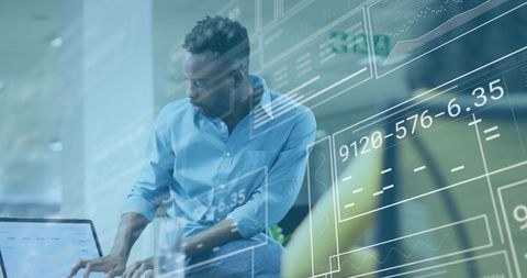 Man typing on laptop with futuristic HUD overlay showing analytics and data interfaces