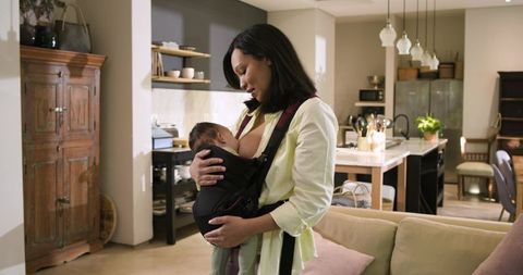 Mother Nursing Infant in Comfortable Home Environment