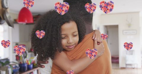 Tender African American Father-Daughter Hug at Home with Floral Hearts
