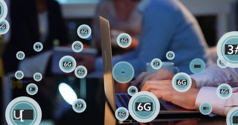 Futuristic business concept with hands typing overlapping 6g symbols