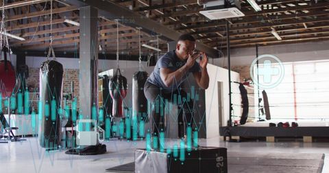 Man performing a box jump in a modern gym with digital stock market data overlay. Image reflects intersection between fitness, technology, and business, signifying how finance and health can intertwine. Suitable for use in financial publications, technology articles, fitness blogs, and advertisements emphasizing data-driven market or personal growth.