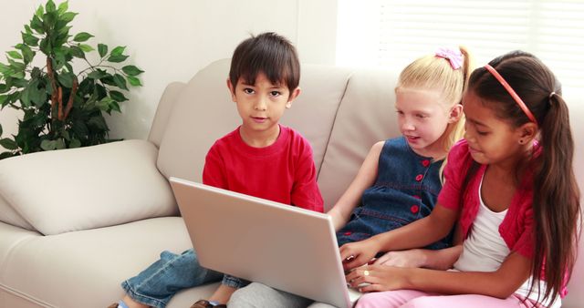 Diverse Kids Using Laptop Together on Couch Learning Technology - Download Free Stock Images Pikwizard.com