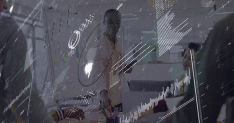 Black leader presenting data visualizations in collaborative modern office meeting