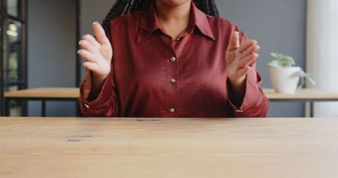 Businesswoman Gesturing with Hands During Collaborative Meeting - Download Free Stock Images Pikwizard.com