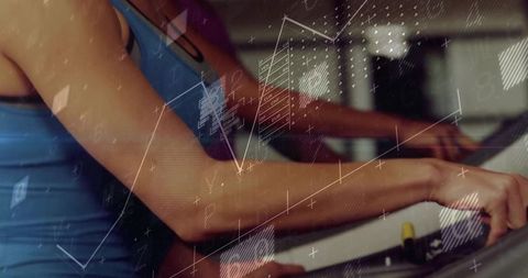 Women Exercising on Elliptical with Digital HUD Overlay, Gym Cardio Close-Up