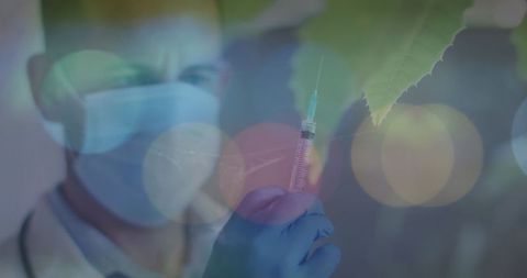 Healthcare professional holding syringe, colors and lights, medical research concept