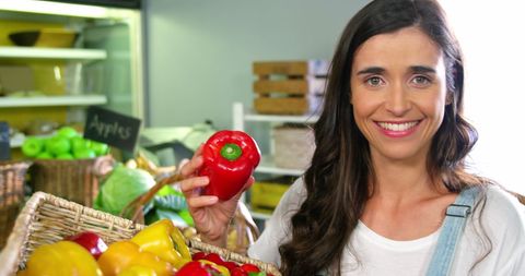 Woman Choosing Bell Peppers at Organic Store - Download Free Stock Images Pikwizard.com