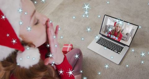 Virtual holiday connection with santa hats and snowfall