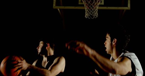 Intense Indoor Basketball Game with Determined Players - Download Free Stock Images Pikwizard.com