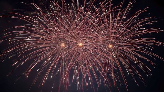 Dazzling night fireworks creating vibrant sparks