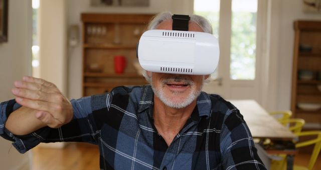 Senior Man Experiencing Virtual Reality with VR Headset in Modern Home - Download Free Stock Images Pikwizard.com