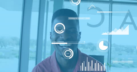 Smiling Man in Office Surrounded by Digital Data Animations