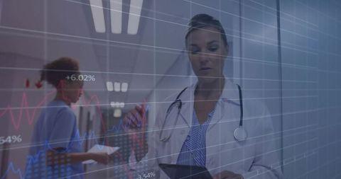 Female Doctor Analyzing Medical Data on Digital Tablet in Hospital