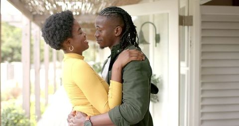 Romantic Couple Embracing on Inviting Front Porch